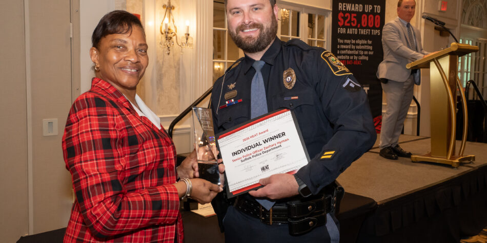 Senior Police Office Zachary Hyman holding his 2026 HEAT Award and smiling
