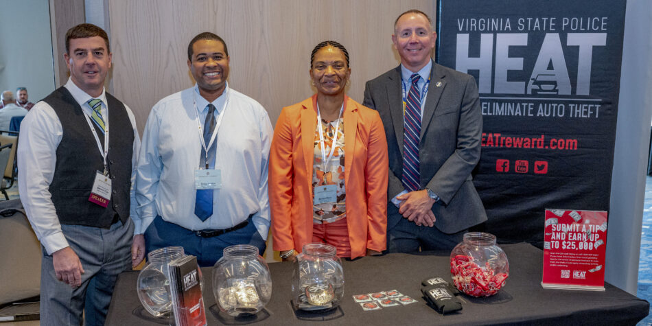 2026 HEAT Award attendees standing behind a table and smiling